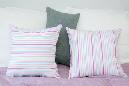 pillows on a bedの写真素材