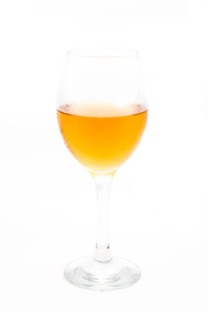 Glass of white wine isolated on a white backgroundの写真素材