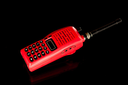 Red walkie talkie on black backgroundの写真素材