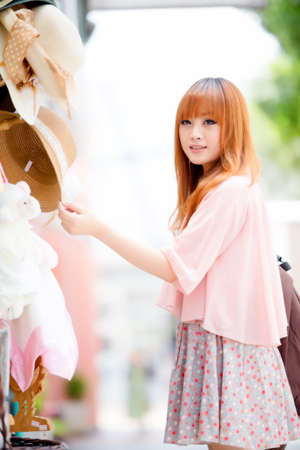 A shot of a beautiful asian woman outdoorの写真素材