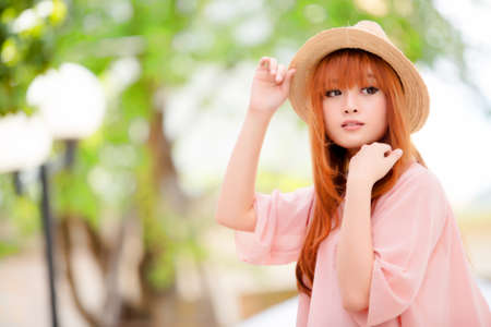 A shot of a beautiful asian woman outdoorの写真素材