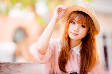 A shot of a beautiful asian woman outdoorの写真素材