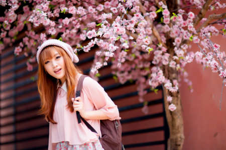 A shot of a beautiful asian woman outdoorの写真素材