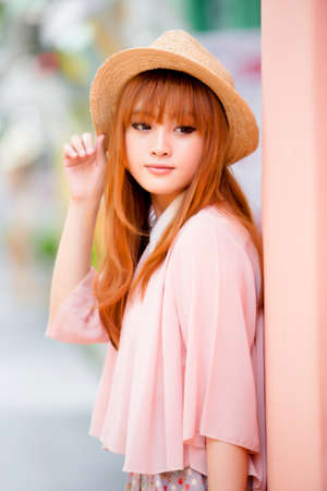 A shot of a beautiful asian woman outdoorの写真素材