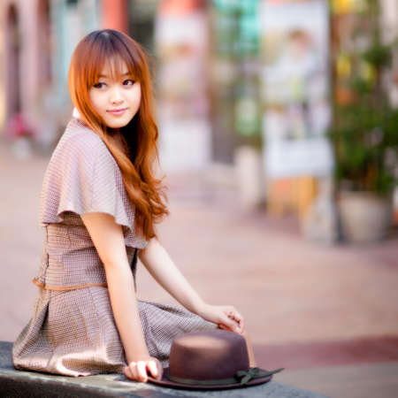 A shot of a beautiful asian woman outdoorの写真素材