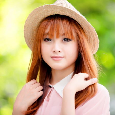 A shot of a beautiful asian woman outdoorの写真素材