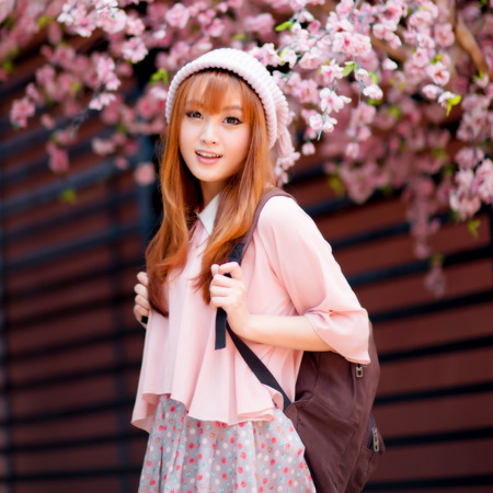 A shot of a beautiful asian woman outdoorの写真素材