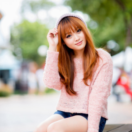 A shot of a beautiful asian woman outdoorの写真素材