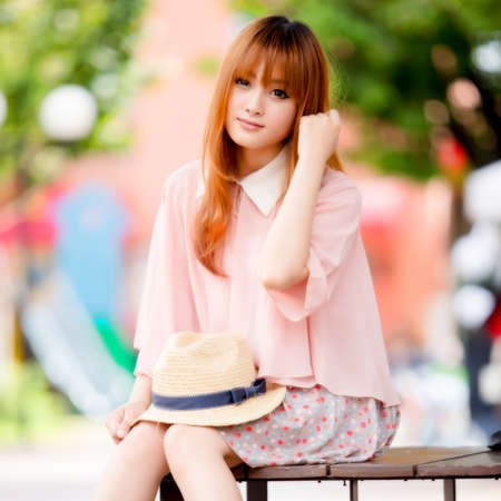 A shot of a beautiful asian woman outdoorの写真素材