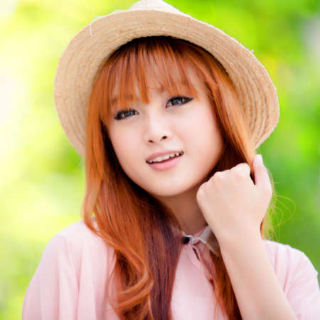 A shot of a beautiful asian woman outdoorの写真素材