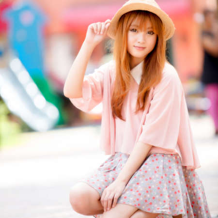 A shot of a beautiful asian woman outdoorの写真素材