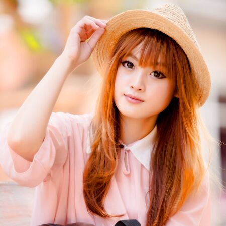 A shot of a beautiful asian woman outdoorの写真素材