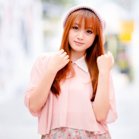 A shot of a beautiful asian woman outdoorの写真素材