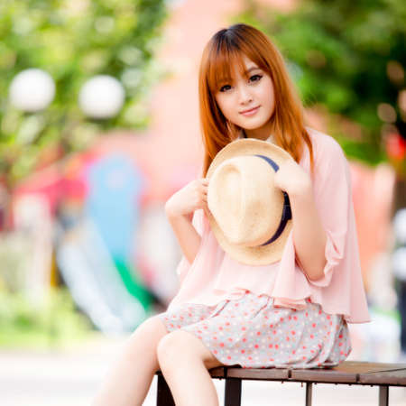 A shot of a beautiful asian woman outdoorの写真素材