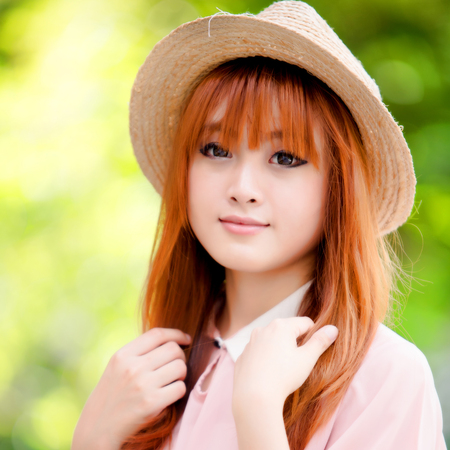 A shot of a beautiful asian woman outdoorの写真素材