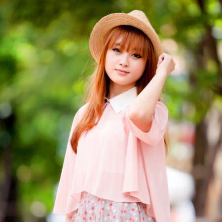 A shot of a beautiful asian woman outdoorの写真素材