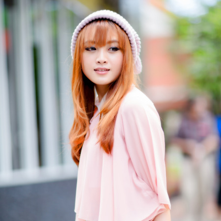 A shot of a beautiful asian woman outdoorの写真素材
