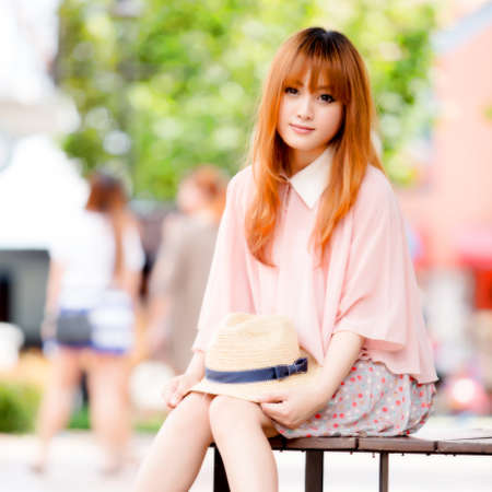 A shot of a beautiful asian woman outdoorの写真素材