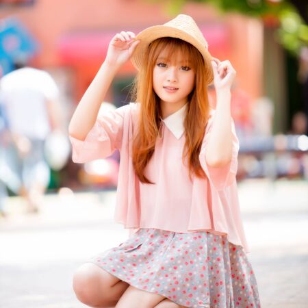 A shot of a beautiful asian woman outdoorの写真素材