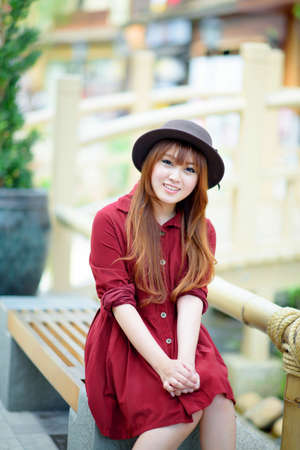 A shot of a beautiful asian woman outdoorの写真素材