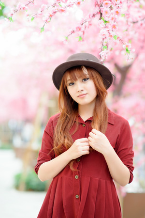 A shot of a beautiful asian woman outdoorの写真素材