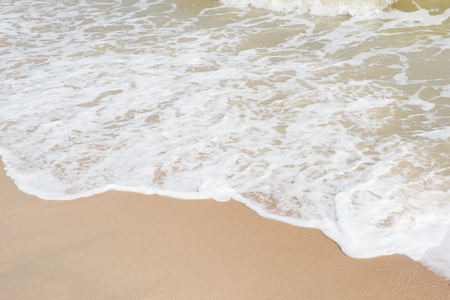 green ocean wave with white sand for backgroundの写真素材