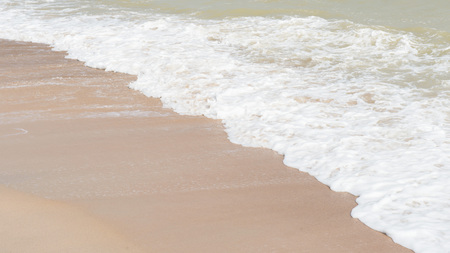 green ocean wave with white sand for backgroundの写真素材