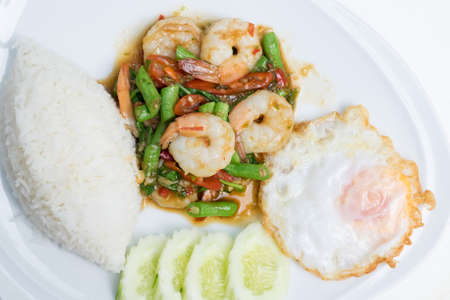 rice and shrimp with Basil and chili sauce and eggの写真素材