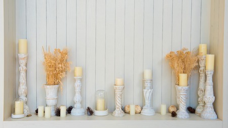 scented candles on white wooden background
