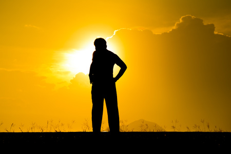 Blurred silhouette a man exercise during sunsetの写真素材