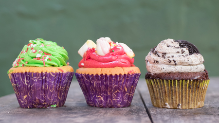 Cupcake on wooden table.