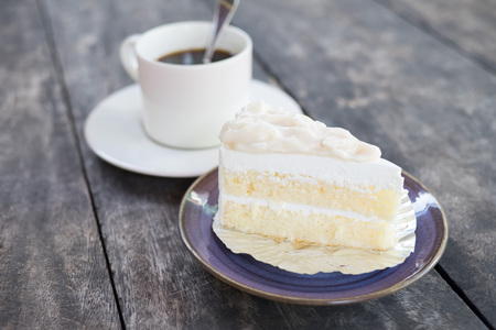 Coconut cake and coffee cup on the tableの写真素材