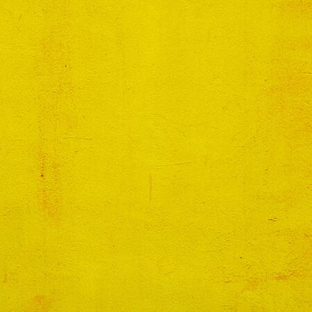 cement yellow wall with street, textured backgroundの写真素材