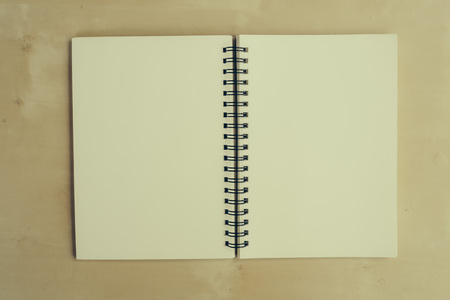 still life with notebook on table - vintage filterの写真素材