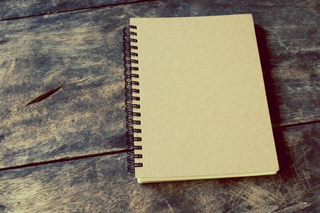 still life with notebook on table - vintage filterの写真素材