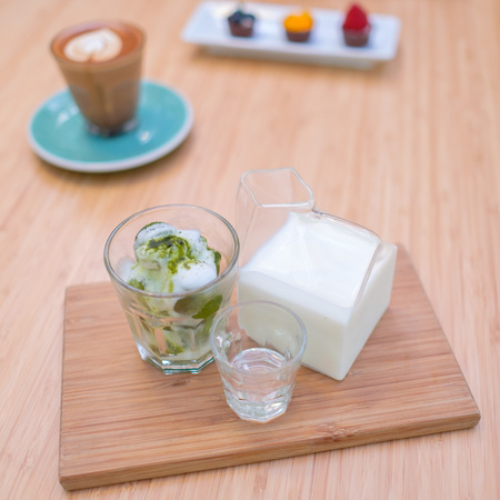 Iced green tea latte on the tableの写真素材