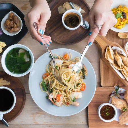 woman have a Spaghetti with shrimpsの写真素材