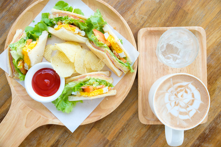 Club sandwich with hot mocha on the table