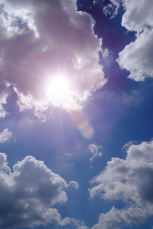 Sunbeam through the haze on blue skyの写真素材
