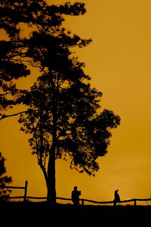 silhouette couple take a photoの写真素材