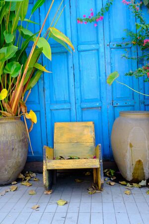 old chair with wood blue backgroundの写真素材