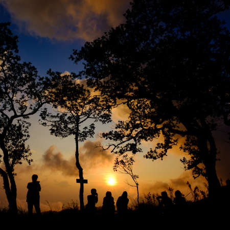 Silhouette people taking photo of beautiful sunsetの写真素材