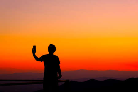 silhouette two people selfie  a pictureの写真素材