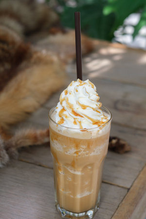 caramel macchiato coffee on the tableの写真素材