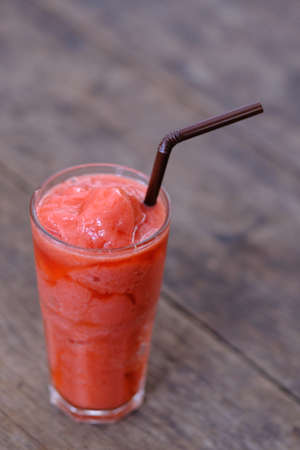 water melon fruit juice frappe on wood tableの写真素材