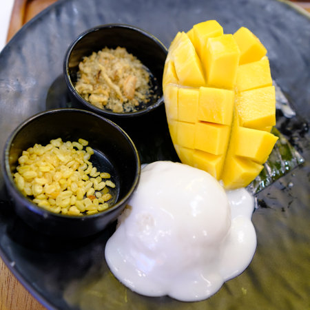 mango with sticky rice  on the tableの写真素材