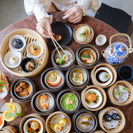 woman eating Timsum as breakfast in the Chines restaurantの写真素材