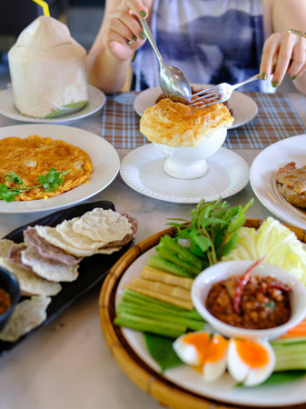 young women eating healthy food in restaurantsの写真素材