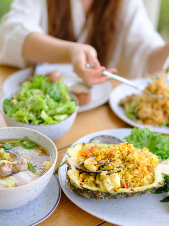 young women eating healthy food in restaurantsの写真素材
