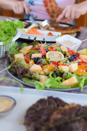young women eating healthy food in restaurantsの写真素材